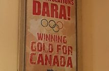 A poster from Dara's 2014 gold-medal win inside The Nutty Chocolatier