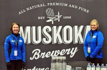 Volunteers Marilyn Kreutzer and Natasha Howard, both Huntsville Curling Club volunteers, welcome spectators to the Moosies On-Ice Bar (Photo: Cheyenne Wood)