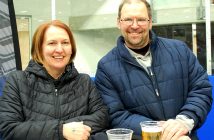 Ontario Tankard spectators, siblings Lisa and Jim Mataija from Bracebridge, enjoy the view from the on-ice bar (Photo: Dawn Huddlestone)