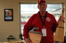 Art Biggar, one-half of the father-son team Biggar Woodworking proudly displays the curling-inspired cutting boards they created for the Ontario Tankard (Photo: Dawn Huddlestone)