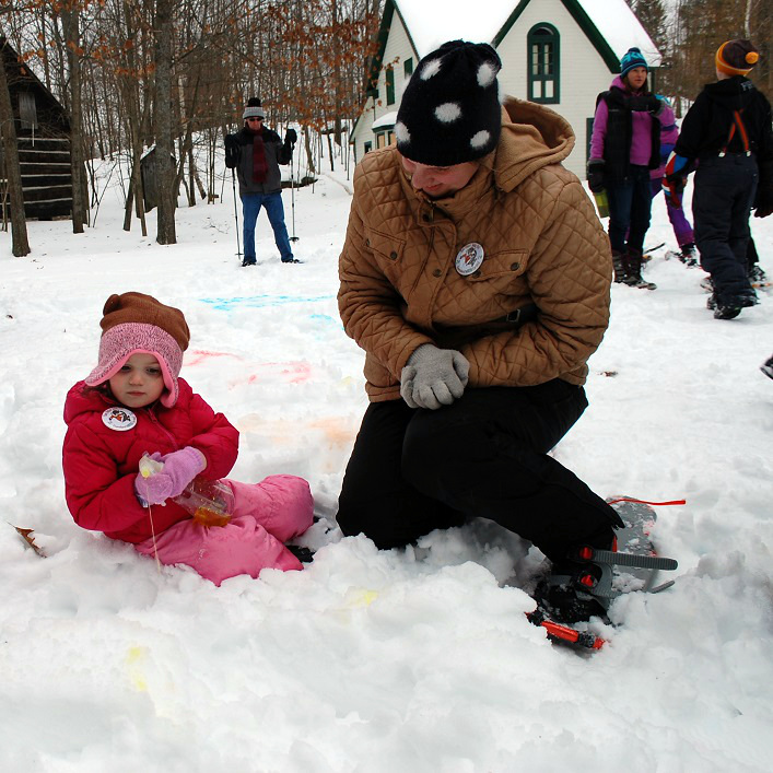 Josie (left) and Valerie Hart try out the snow painting