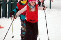 Dakota Quigg (front) of HPS and Kristen Marshall of Riverside take a lap around the penalty loop