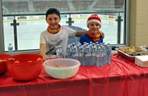 Wilson Trenholm (left) and Tyler Bishop man the post-tri snack station
