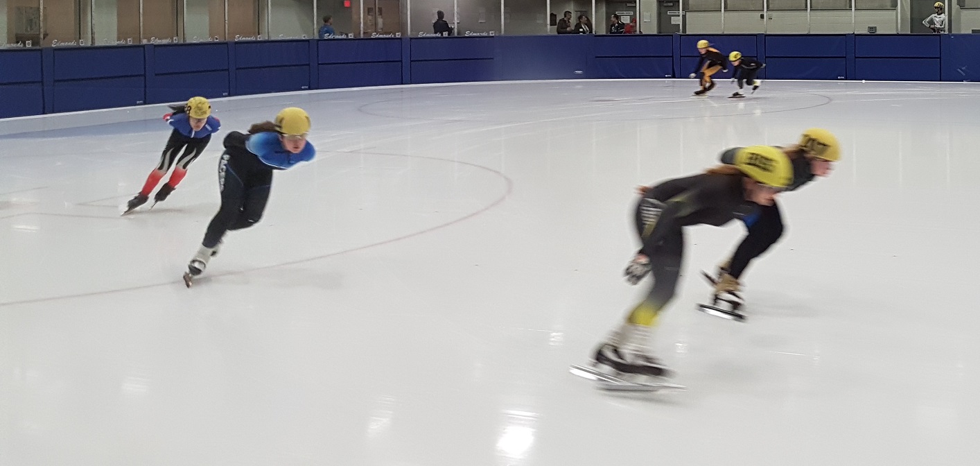The 14 and 15 year old female speed skaters warm up on the Don Lough ice