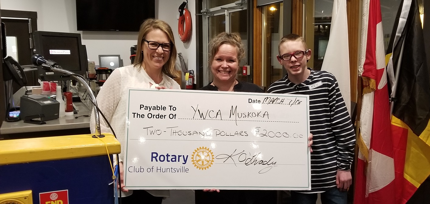 Kim O’Grady (left), president of The Rotary Club of Huntsville, presents a cheque to Marcy Hill from Boys Quest and Ken St. Pierre.