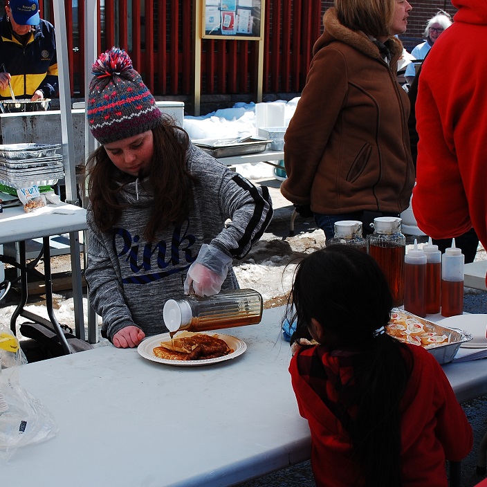  Elyse Jarvis adds some maple syrup to hot-off-the-griddle pancakes