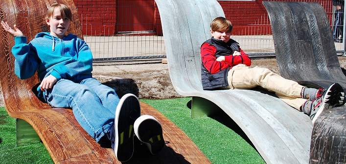 Oliver (left) and Miles Fisher relax in the concrete loungers created by D2B2
