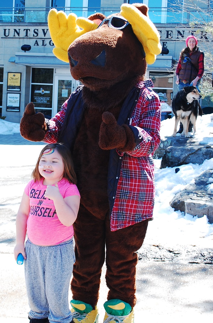Sophie Chodor, 6, gives a thumbs-up for Marty the Moose