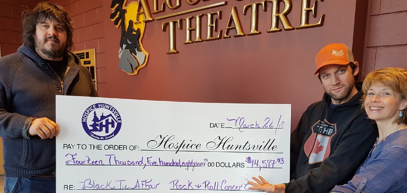 Jamie Clark (left) and Mike Shaver present the proceeds from the second annual Rock and Roll Black Tie Affair to Melissa Polischuk (right) from Hospice Huntsville (supplied)