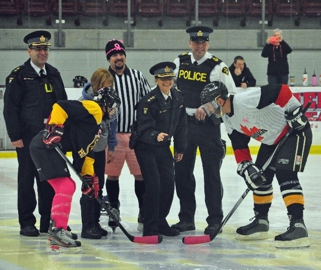The ceremonial puck drop was performed by xxx, with (back from left) xxx, HHS principal Kim Williams, Scott Doughty (General Manager of Hidden Valley Resort), and Huntsville OPP Staff Sergeant John Graham 