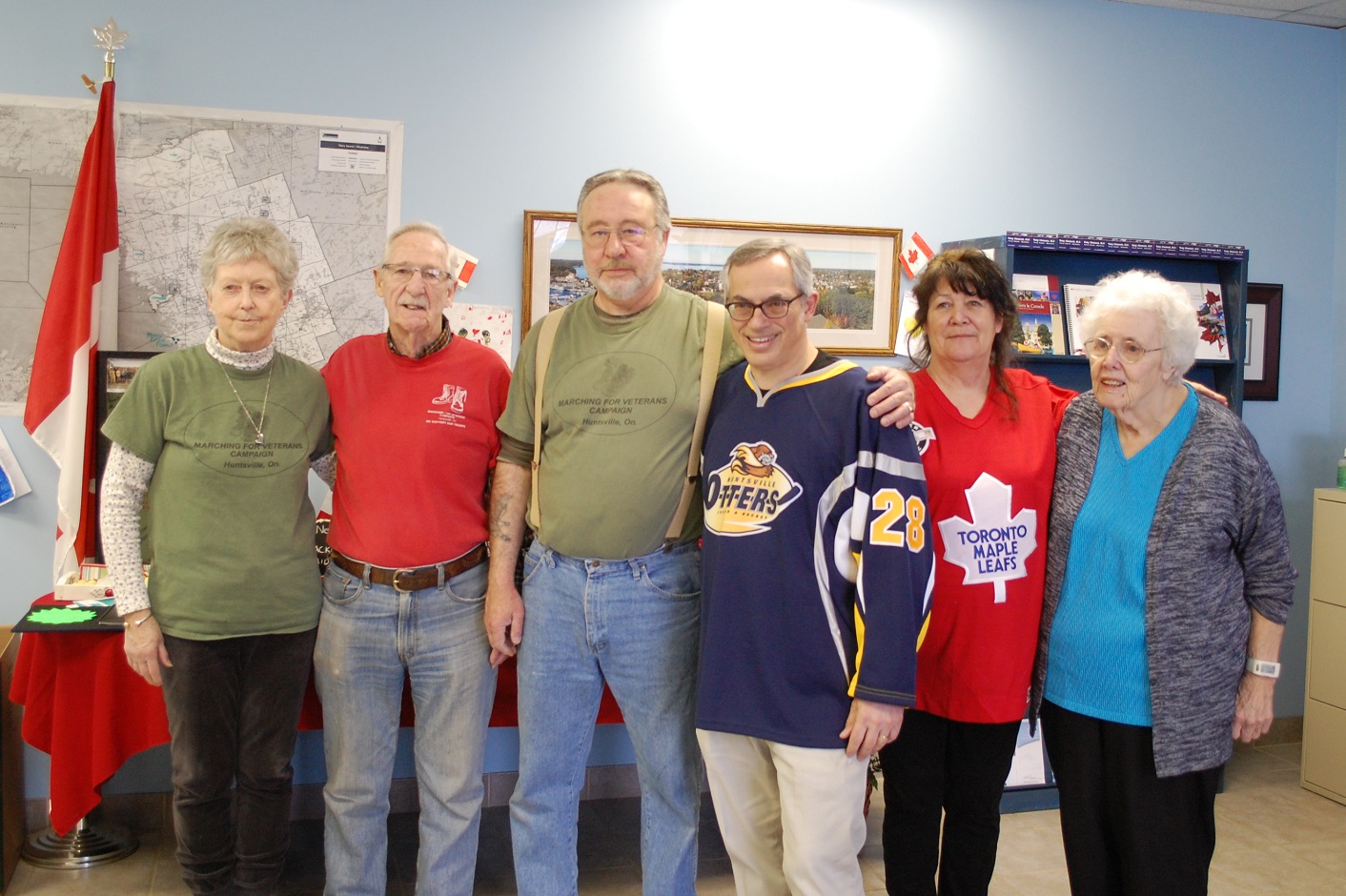 (From left) Jan and Dave MacDonald, Rick Thomas, MP Tony Clement, Catherine Kahler and Bernice Greenfield packed care packages for troops on April 12