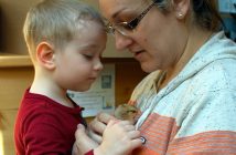 Darius Urquhart and mom Hillary Bignell cuddle a chick