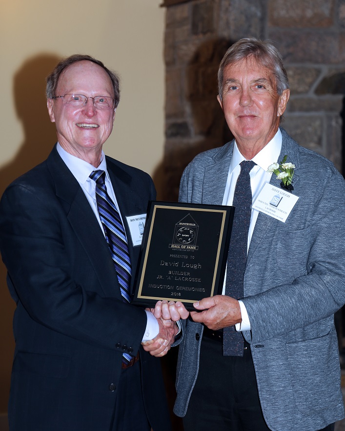 Dave Lough (right) receives his induction plaque from Hall of Famer Don McCormick