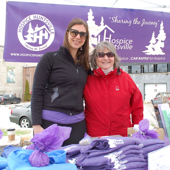 Jen Salmon (left) and Jane Weiland sell t-shirts in support of Hospice Huntsville