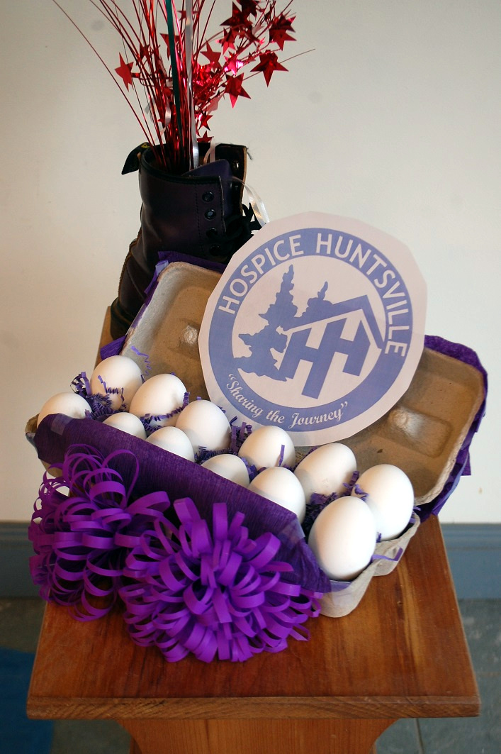A dozen eggs, one of them raw