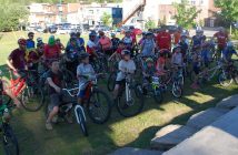 Participants in the 2018 Mayor's Bike Ride get route instructions from organizer Lowell Greib of The SportLab