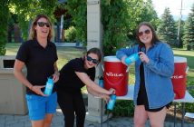 (From left) Katie Love, Sophia Hatkoski, and Taylor Smith helped riders stay hydrated
