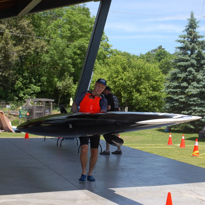 Solo kayaker Vadim Lawrence crosses the first portage on his way to an eventual second place finish