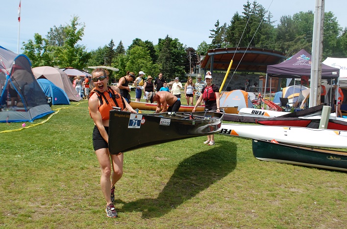 Jen Nicholson (front) and Rebecca Francis, members of relay team Red Planet Paddlers, get ready to put in at the start of the race