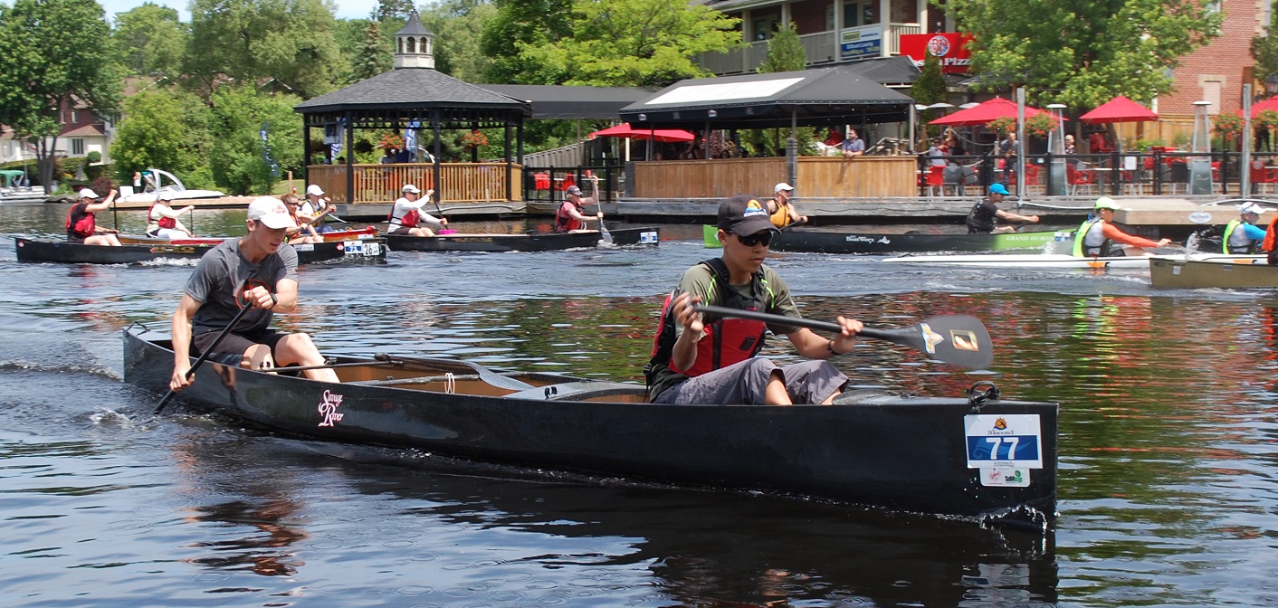 Relay team Don’t Get In A Canoe With Strangers #1 (foreground) at the start of the first lap