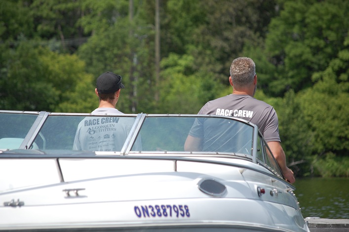 The rescue boat keeps a close eye on the start of the race