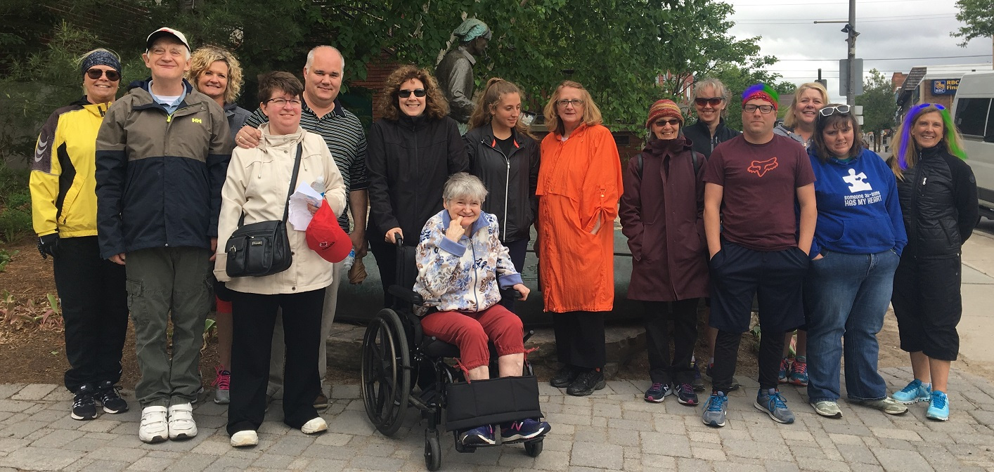 Some members of Community Living Huntsville’s Inclusion in Motion team (about half of them are pictured here) will dye their hair blue and green now that their fundraising goal has been met, including Steve Speicher (front, third from right) and Andrea Johnston (right). (Digitally altered photo.)