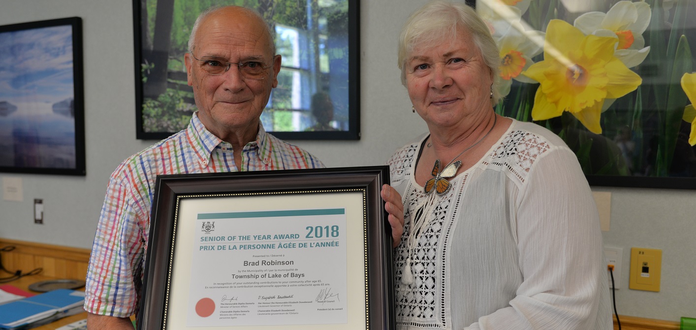 Brad Robinson (left) receives the Lake of Bays 2018 Senior of the Year award from Deputy Mayor Nancy Tapley (supplied photo)