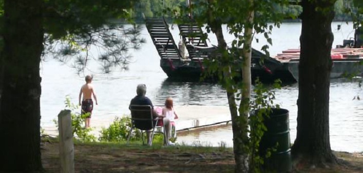 A barge pulls in to the public boat launch at 4066 South Portage Rd (Photo from a presentation to General Committee by Councillor Dan Armour)
