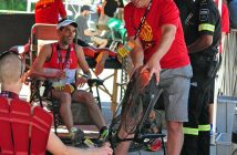 Dr. Rich Trenholm adjusts a fan to help athletes cool down