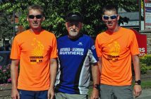 Volunteers (from left) Nathan Johnstone, Andre Boudreault and Owen Johnstone helped out at a water station near Shoppers Drug Mart