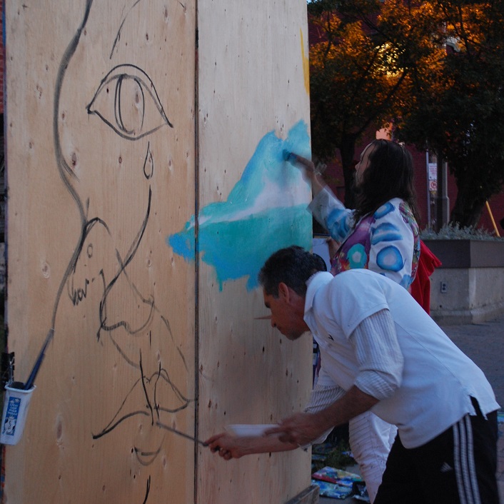 The Silver Elvis mural team created a large-scale painting on Main Street