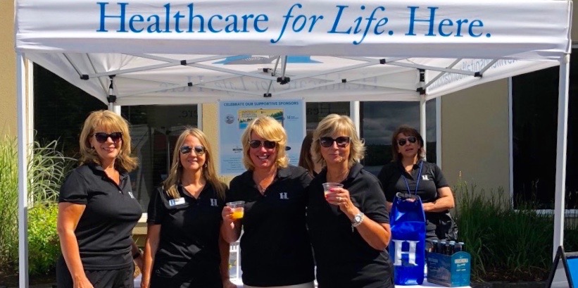 (From left) Jenna Carr, Cheryl Perry, Leslie Jones, and Marian Shaw take a deserved break from their volunteer duties at the HHF Charity Golf Tournament (supplied photo)