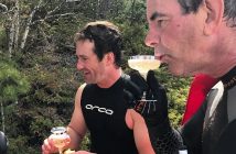 Glenn shares champagne with support swimmers (including Dr. Rich Trenholm, left) after the second leg of his swim on May 21 (Photo via @glenn.vickery/Instagram)