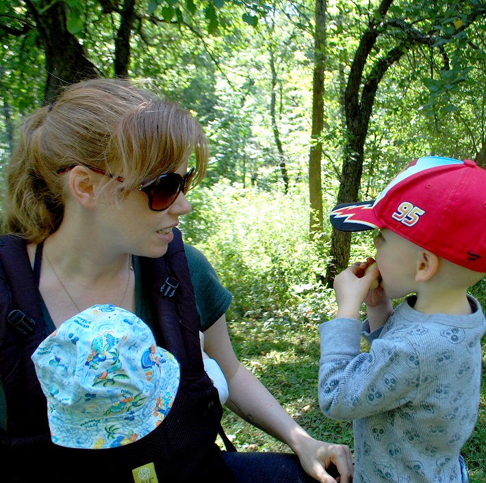 Cash Bryant (right) tastes an apple with mom Tasha and baby brother Beau