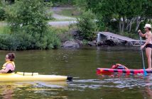 Volunteers in kayaks, canoes, SUPs and boats supported Glenn throughout his swim
