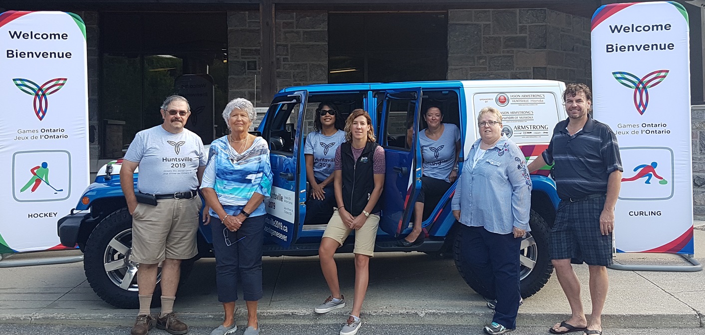 Members of the Huntsville 2019 Games Organizing Committee unveil the Games Jeep provided by Drive Muskoka