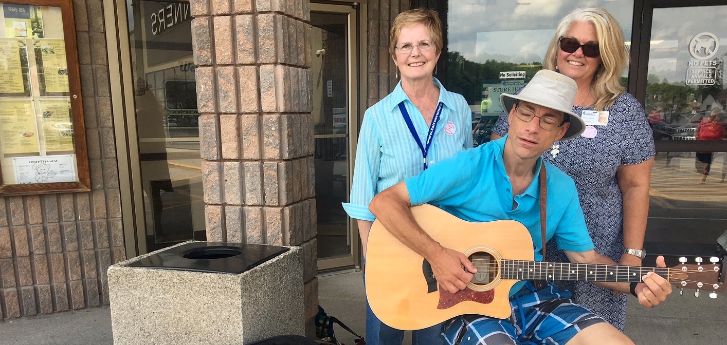 Rob Seymour busking for Paddle for Fairvern with Mary Edmonstone (left) and Tracy Badger