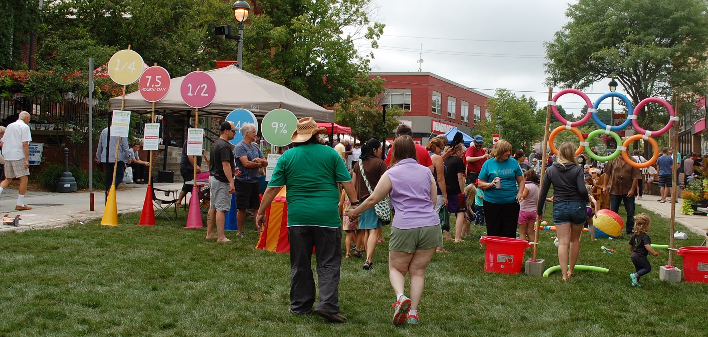 The grass on Main Street, installed as part of the Green Street Challenge, drew lots of curious people of all ages