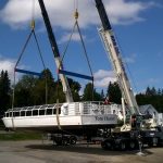 It took two cranes to lift the Tom Thomson off the truck for its launch into Mary Lake at Port Sydney (Photo: Stephenson District Lions Club/Facebook)