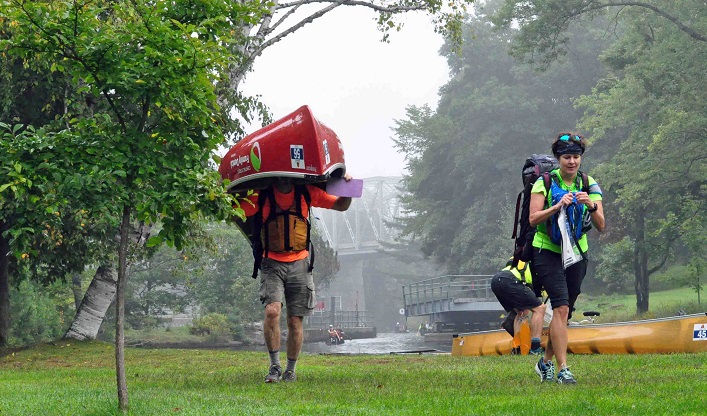 Team Das Boot, Dave Nichols and Catherine Zacal from Huntsville, portage past the Brunel Locks (Photo: Cheyenne Wood)