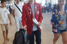 Ian Markham's host family greets him at the airport in France