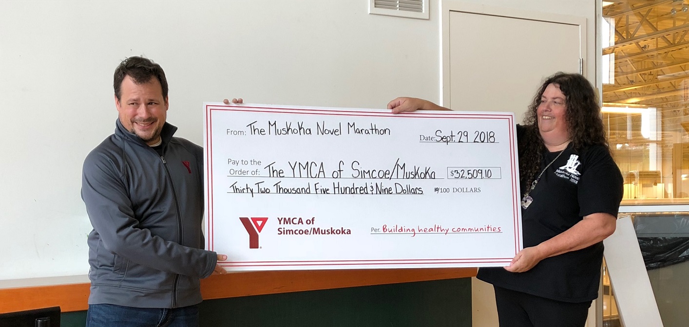 Brian Shelley (left) of the YMCA accepts a cheque from Muskoka Novel Marathon Convenor Karen Wehrstein