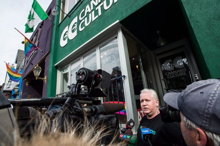 Stores in Ontario currently selling cannabis illegally will need to shut down before Oct. 17 and they apply for a legal retail licence. In this photo from March 2017, store manager Mark Harrison speaks to media outside a Cannabis Culture store following a police raid in Toronto on Thursday, March 9, 2017. (THE CANADIAN PRESS/Aaron Vincent Elkaim)