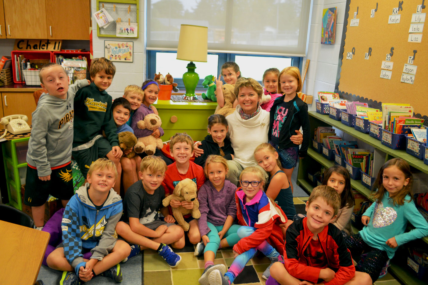 Madame McIlmoyle surrounded by her adorable Grade 2 students. She is big on teaching the kids about kindness and respect and strives to let kids know they each have a special gift.