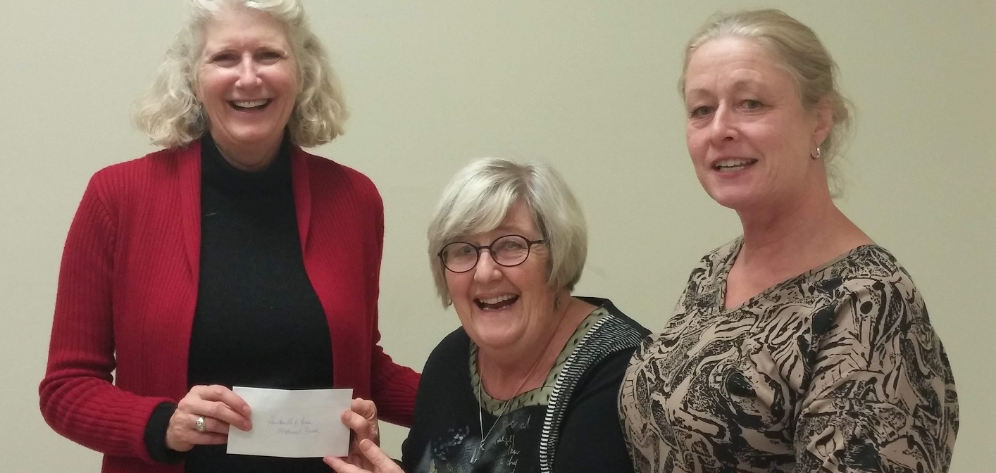 Maureen Hunt’s daughter Jane Hunt (left) presents a cheque to Tricia Markle (centre) and Elizabeth Stokes Weber of the Huntsville and Area Historical Society (supplied)