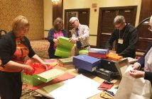 Rotarians prepare boxes to be filled (supplied photo)
