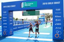 Raylan Jamison crosses the finish line of the standard triathlon with another Canadian athlete at the ITU World Championship Grand Final Gold Coast 2018 (supplied photo)