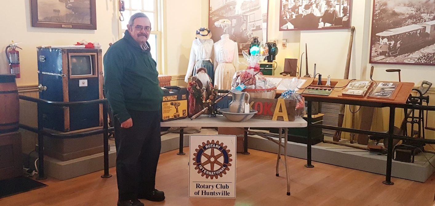 Rotarian Peter Redwood with just a few of the hundreds of items available in the annual Rotary Club of Huntsville auction