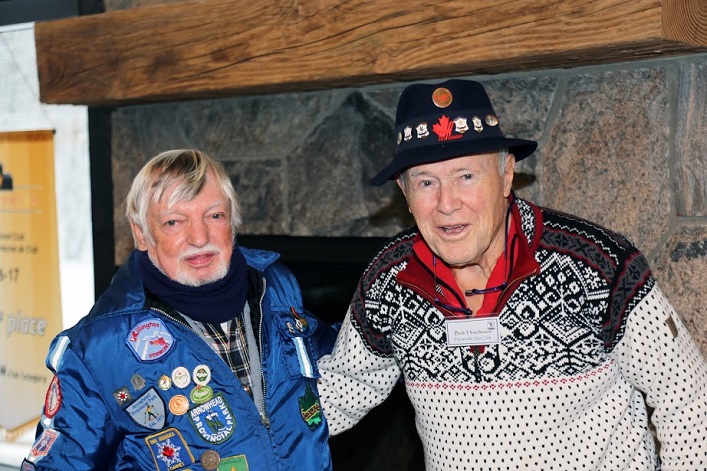 Lloyd Henry (left), in his recognizable jacket, and Bob Hutcheson in front of the fireplace at the new Arrowhead Visitor Centre. (Photo: Don McCormick)