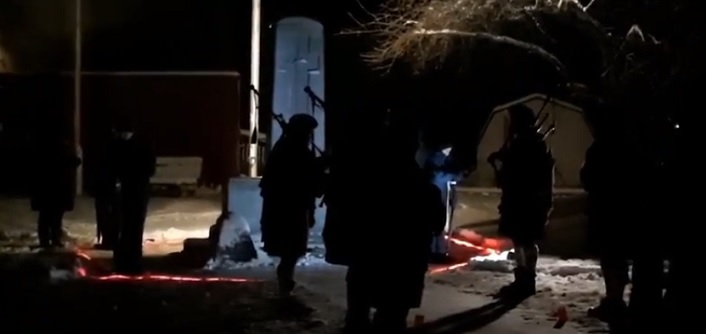 Members of the Cameron of Lochiel Pipes and Drums band at the Huntsville cenotaph in the early hours of Nov 11, 2018